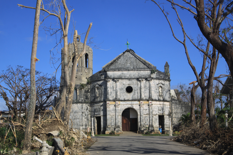 A church stands amidst the ruins caused by Typhoon Haiyan in the village of Daanbantayan, northern Cebu, Philippines. A UMNS photo by Ray Buchanan.