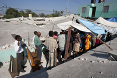 Congregants hold an outdoor worship service.
