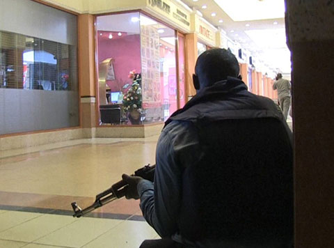 A member of the Kenyan security forces takes position inside the Westgate Mall following a Sept. 21 attack by masked gunmen in Nairobi. 
Photo by Nichole Sobecki/AFP/Getty Images.