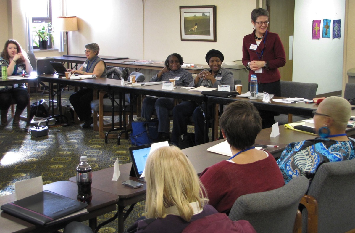 Bishop Sally Dyck of the Northern Illinois Conferenct (standing), host of one of two Ministry with the Poor roundtables, welcomes participants. She is one of several United Methodist leaders who are re-examining how the church ministers with the poor. A UMNS photo by Anne Marie Gerhardt.