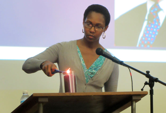 The Rev. Dountonia Slack lights a candle remembering victims of domestic abuse during an Oct. 2-4 conference hosted by St. Luke’s United Methodist Church in Indianapolis.