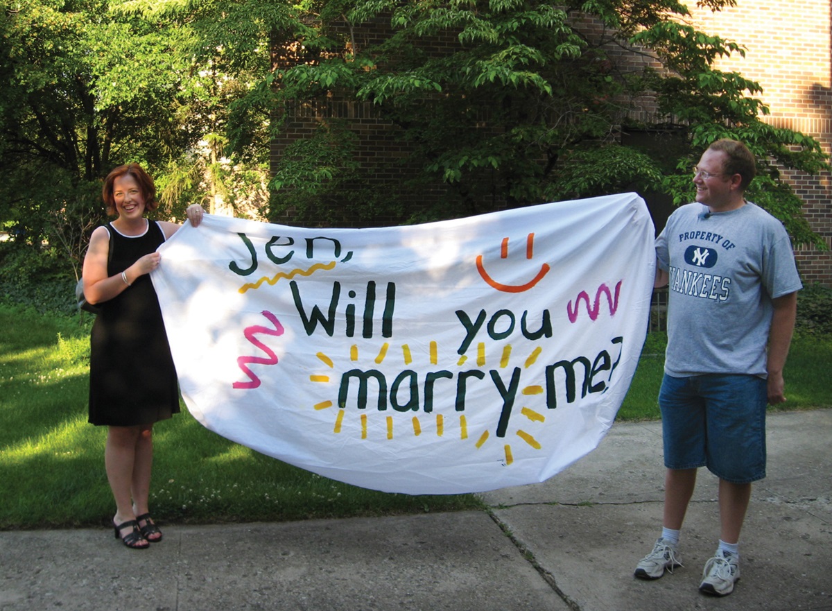 Jennifer Dobbs and Matthew Oates share a moment after she said, “Yes” to his proposal of marriage in July 2008.  Photo by Marsha Esau. 
