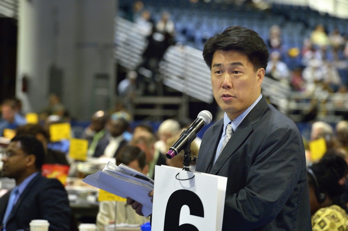 The Rev. We Hyun Chang, a pastor in Belmont, Mass., and a delegate from the New England Annual (regional) Conference, argues to reconsider retaining guaranteed appointments for clergy, during a debate at the 2012 United Methodist General Conference in Tampa, Fla. The guarantee of an annual appointment for elders was eliminated by the conference on May 1.