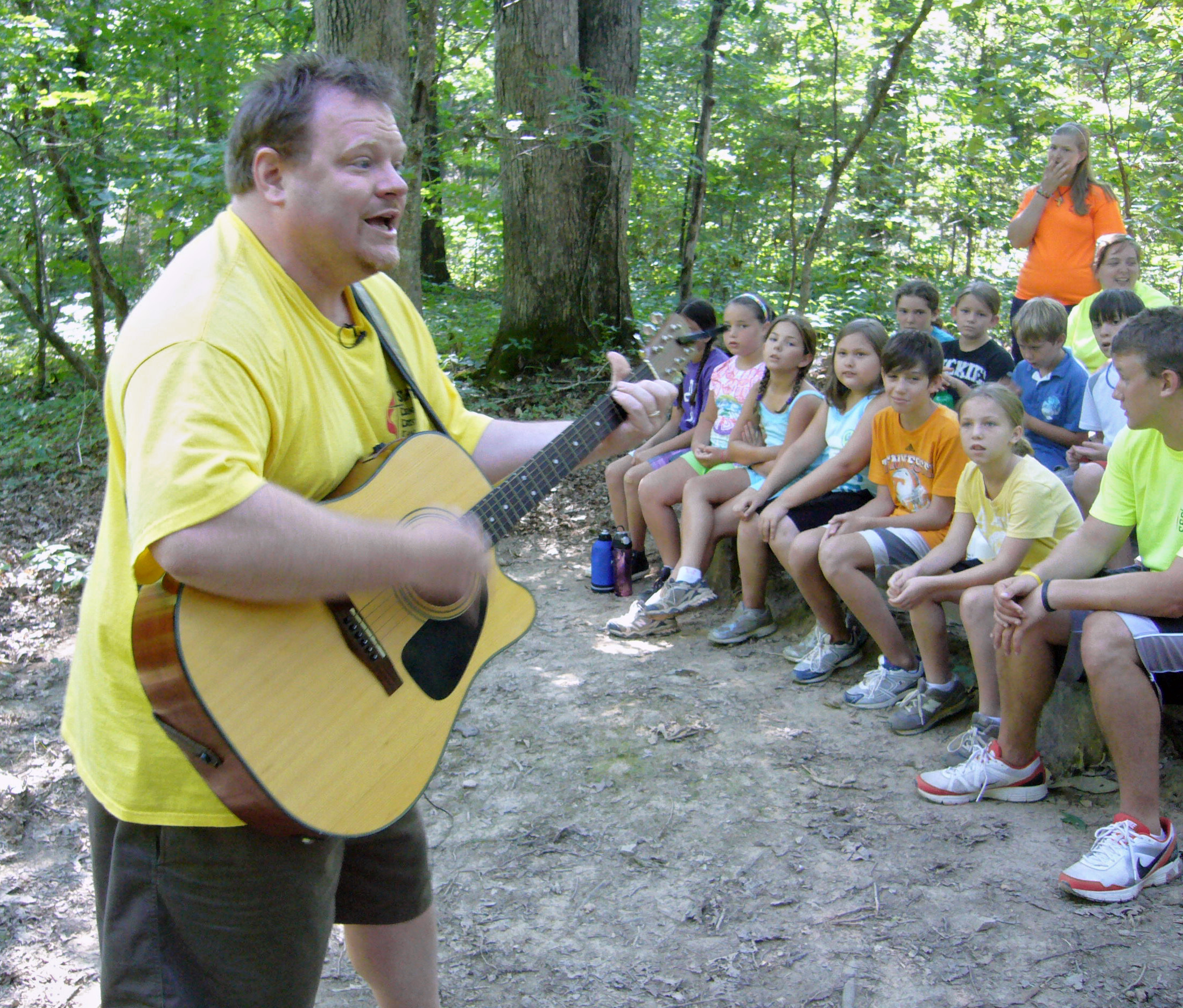 Will Penner leads a gospel song during worship at Cedar Crest Camp in Lyles, Tenn. Photo by Ronny Perry, UMNS.