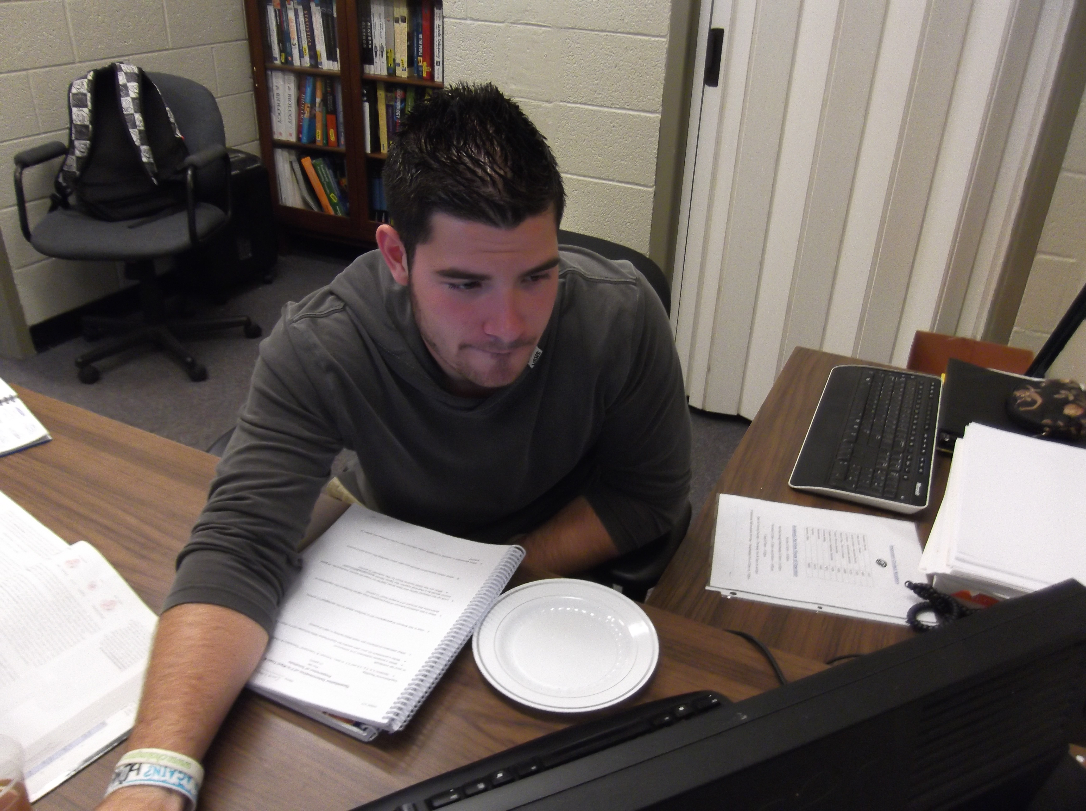 First generation student Chris Liberati studies at Adrian College.