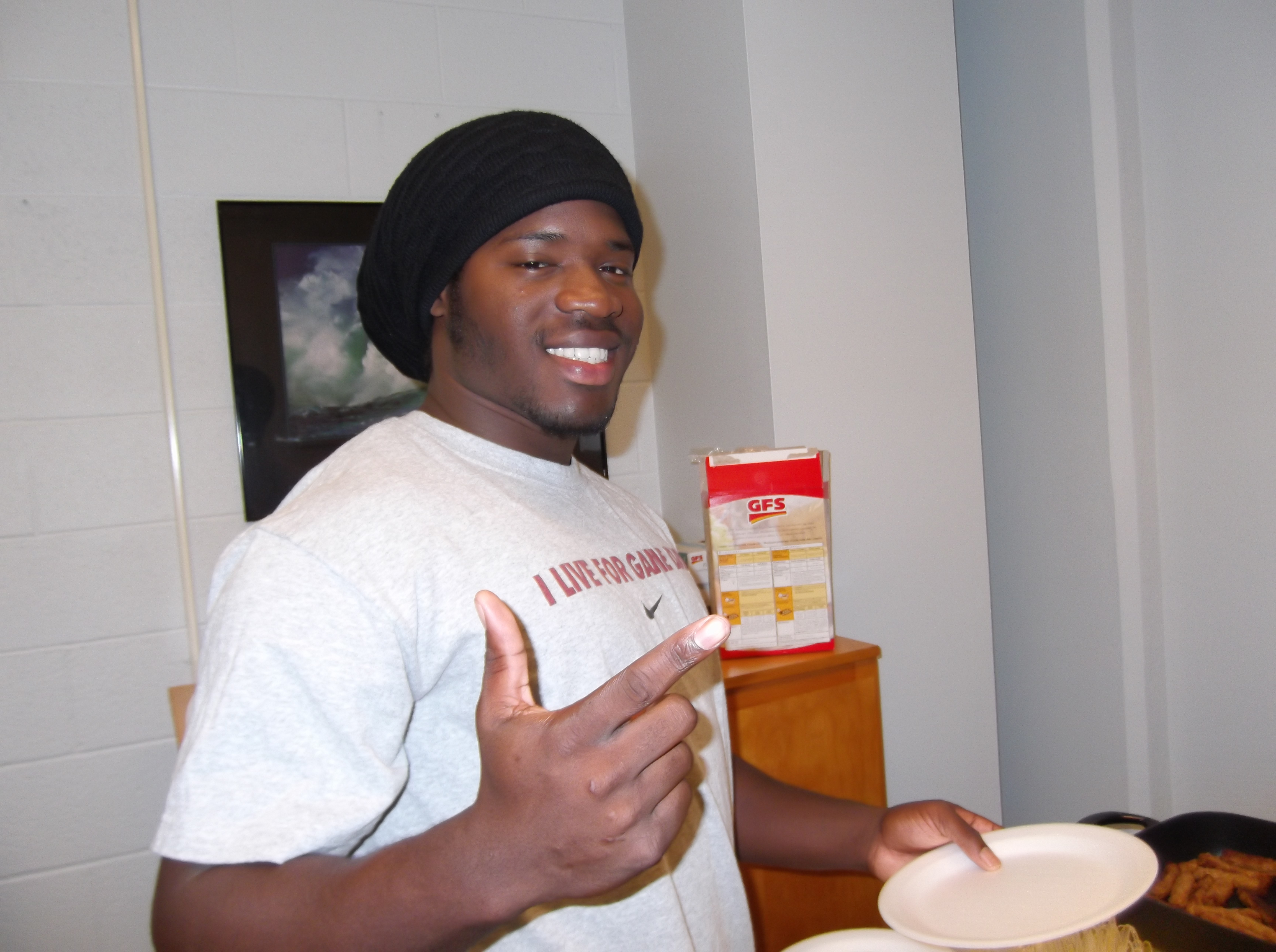 First generation student Keith Allen enjoys a pancake breakfast at Adrian College.