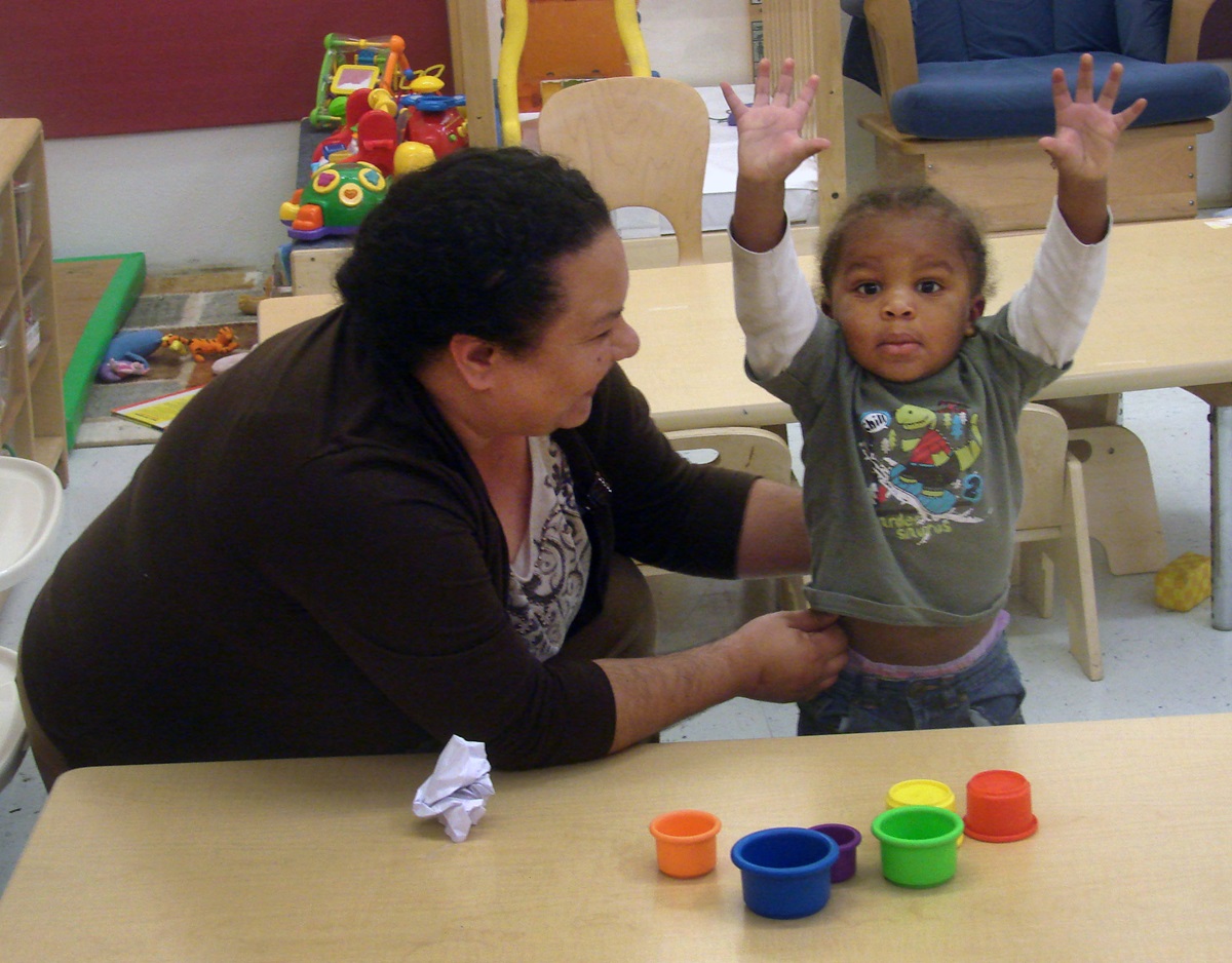 Sara Dominguez works in child care at Dallas Bethlehem Center, including supervising this exuberant 20-month-old. Photo by Sam Hodges, UMNS