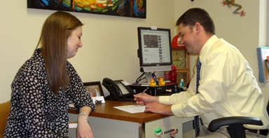 Ryan Brechbill, Director of the Center for Career & Professional Development at Otterbein University, advises student Haley Young, a public relations major. Photo by Marilyn Williams. Ryan Brechbill, Director of the Center for Career & Professional Development at Otterbein University, advises student Haley Young, a public relations major. Photo by Marilyn Williams.