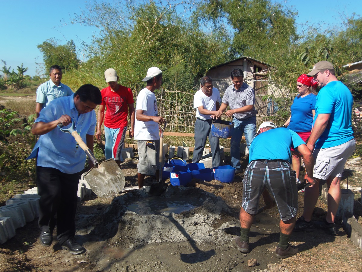 North Georgia Annual (regional) Conference work with Pangatian community members in Cabanatuan City, mixing concrete for the multipurpose hall foundation, as part of the conference’s Bridges Philippines project. Photo courtesy of Wesleyan University-Philippines.