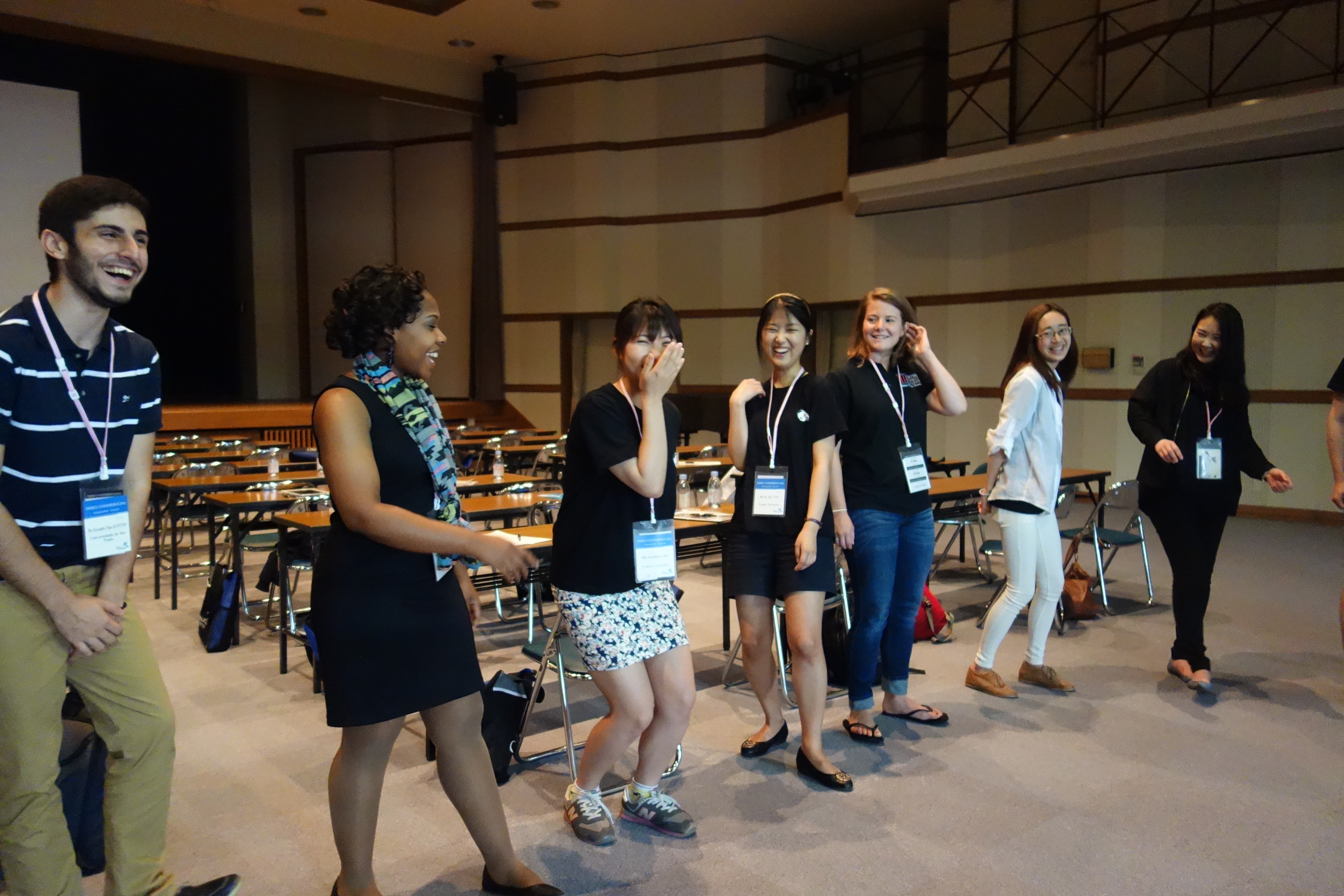 "Whoosh! Zing!" Students attending the annual conference of the International Association of Methodist Schools, Colleges and Universities pass an imaginary "energy ball" during a workshop at Hiroshima Jogakuin University on May 27. Photo by Diane Degnan, United Methodist Communications.