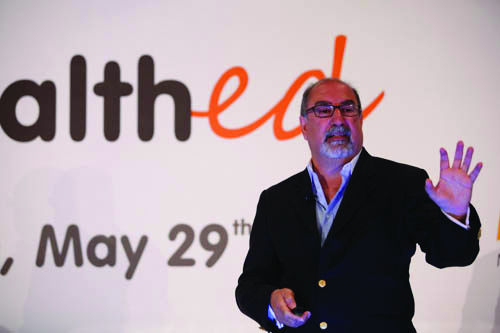 Firdaus Kharas leads a presentation on health education. Photo courtesy of Firdaus Kharas/Chocolate Moose Media