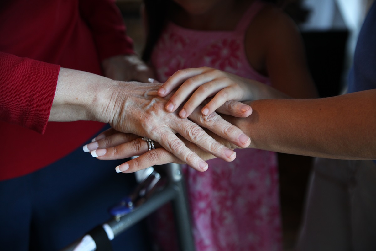 Three generations of hands; grandmother, mother and daughter. Photo illustration by Kathleen Barry, UMNS.