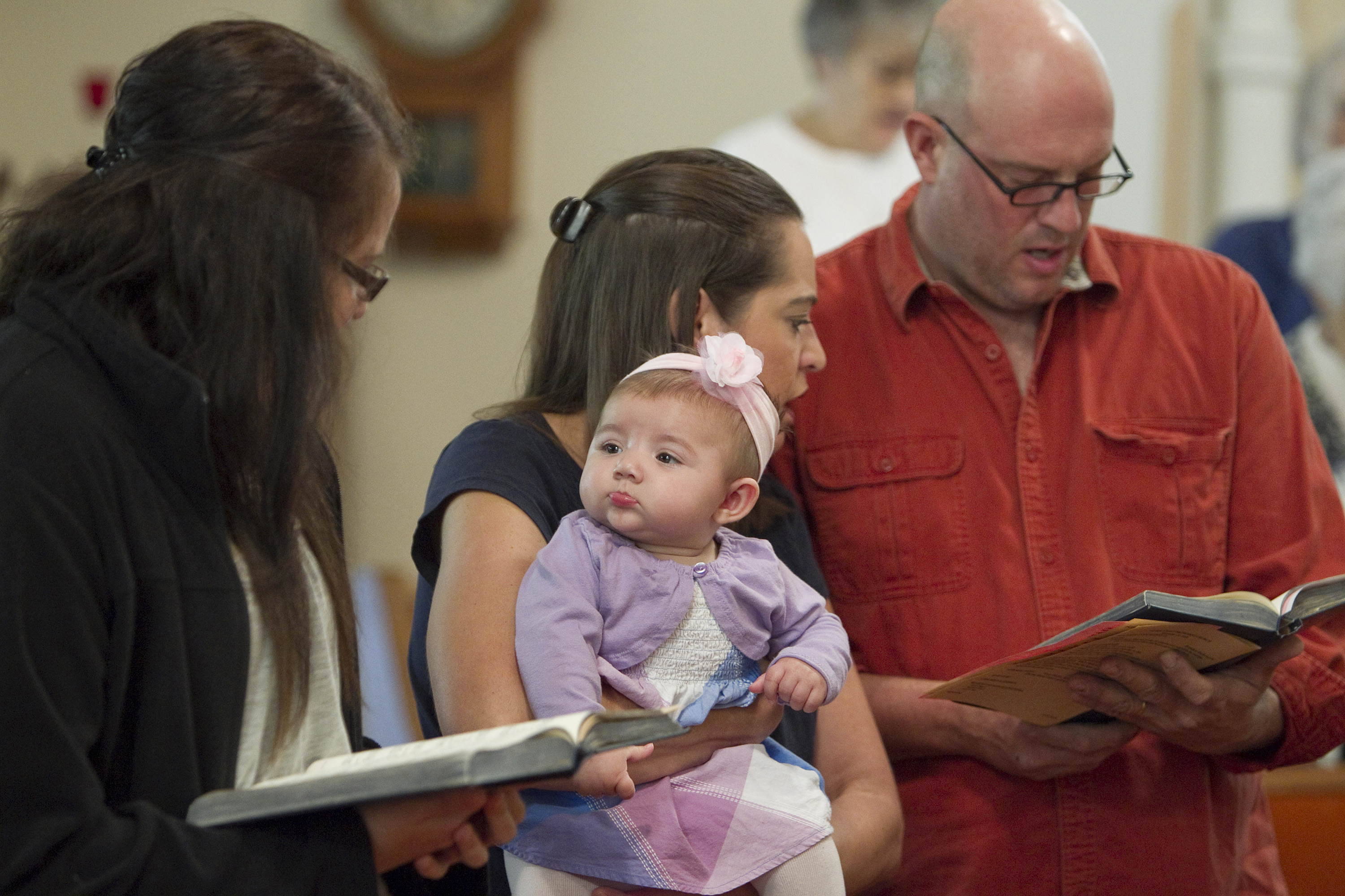 New life brings new hope at rural churches. Avery Guest, 6 months, keeps a watchful eye on Kati Thain during worship at Gilboa (Ohio) United Methodist Church. Photo by Mike DuBose, UMNS.