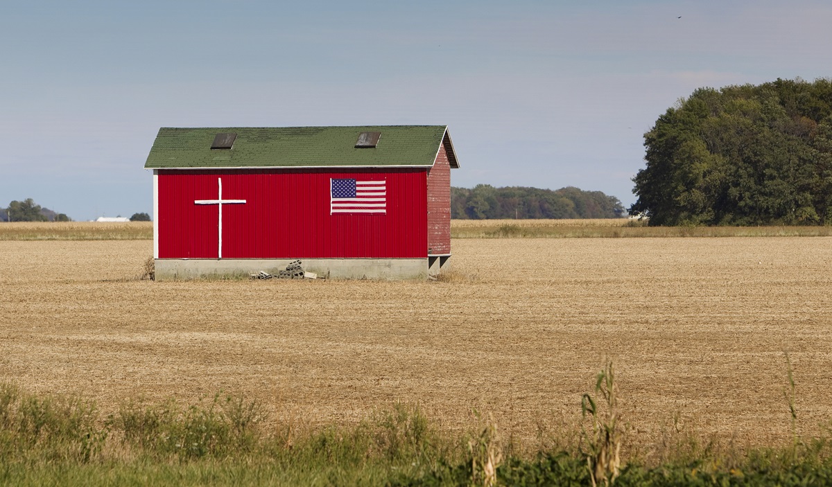 Symbols of God and country adorn a farm building near Van Wert, Ohio. Photo by Mike DuBose, UMNS.