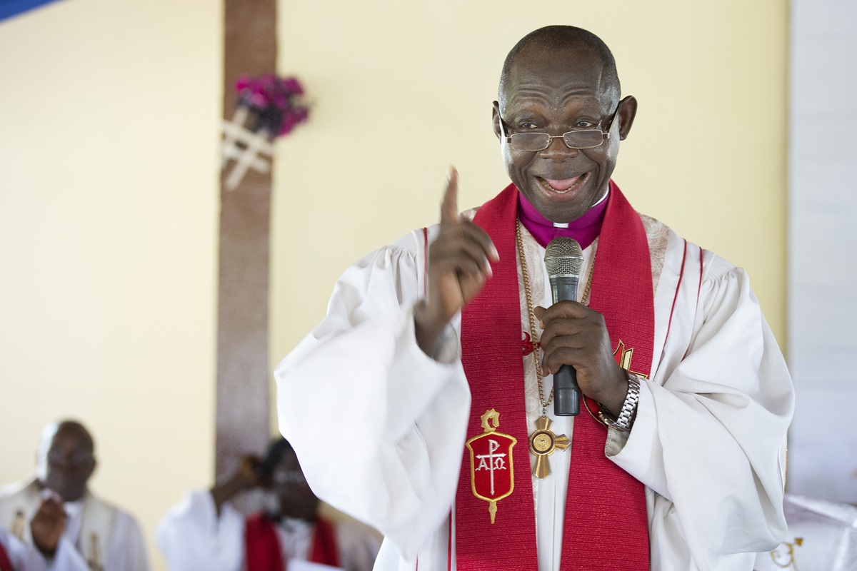 Bishop John K. Yambasu speaks on the Ebola virus during a service of dedication at Valunia United Methodist Church outside Bo, Sierra Leone.  