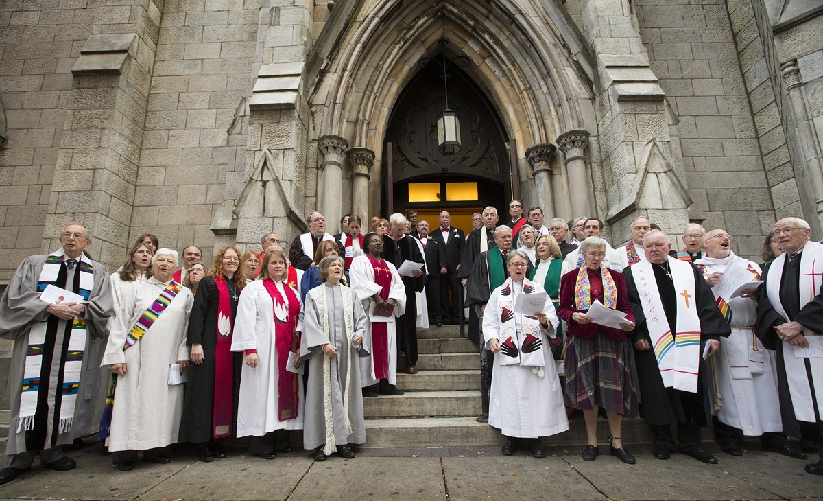 Clergy and faith leaders gather outside Arch Street United Methodist Church in Philadelphia in support of  Richard Taylor and William Gatewood (at top of stairs in doorway) following their Nov. 9, 2013 wedding