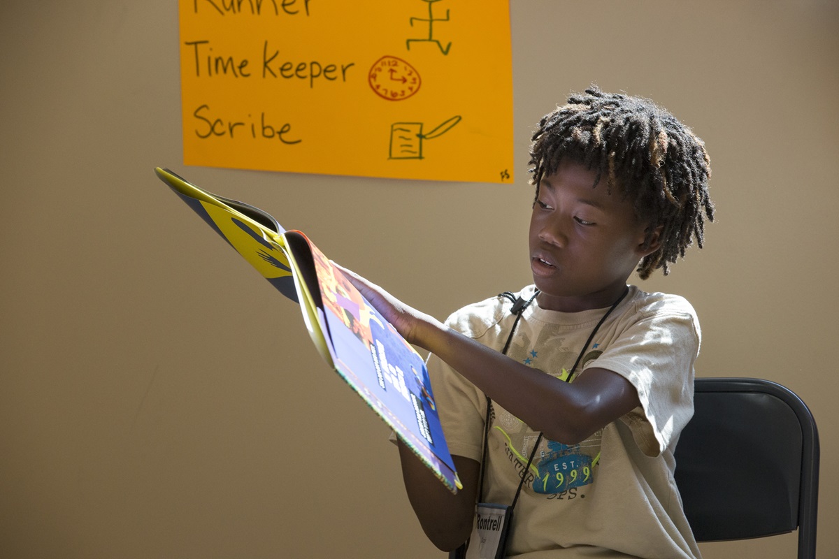 Rontrell reads the book "Looking Like Me," during the Freedom School at Gordon Memorial United Methodist Church in Nashville, Tenn. The program, offered free to families, encourages stronger reading and writing skills among students in grades 5-8. Gordon is one of several United Methodist congregations across the United States hosting Freedom Schools this summer. 