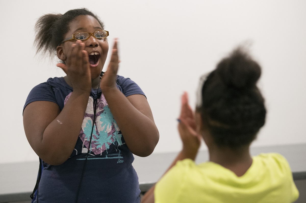 Kimiyah surprises herself by saying her chosen word loudly and with confidence during a vocabulary-building exercise at Freedom School at Gordon Memorial United Methodist Church in Nashville, Tenn. 