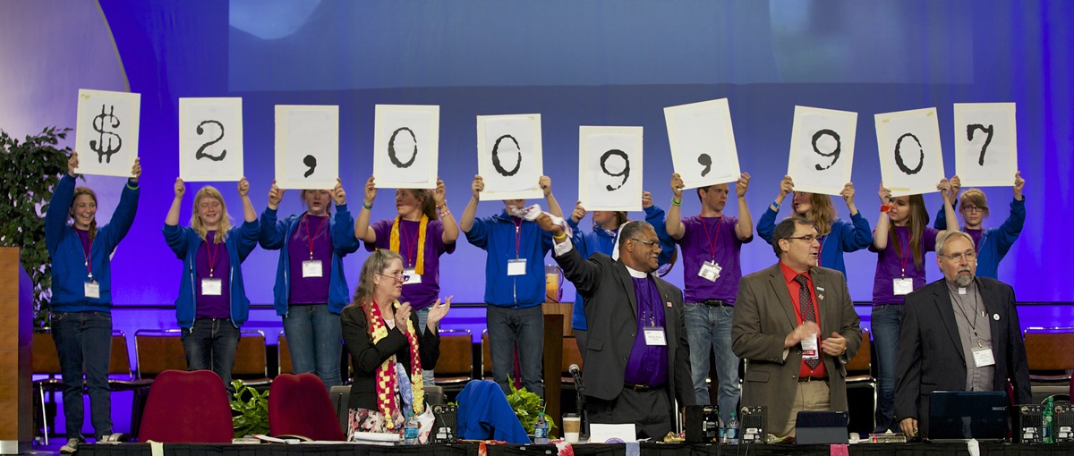 The Iowa Annual Conference celebrates surpassing the $2 million mark in its Imagine No Malaria campaign. Photo by Arthur McClanahan, Iowa Conference.