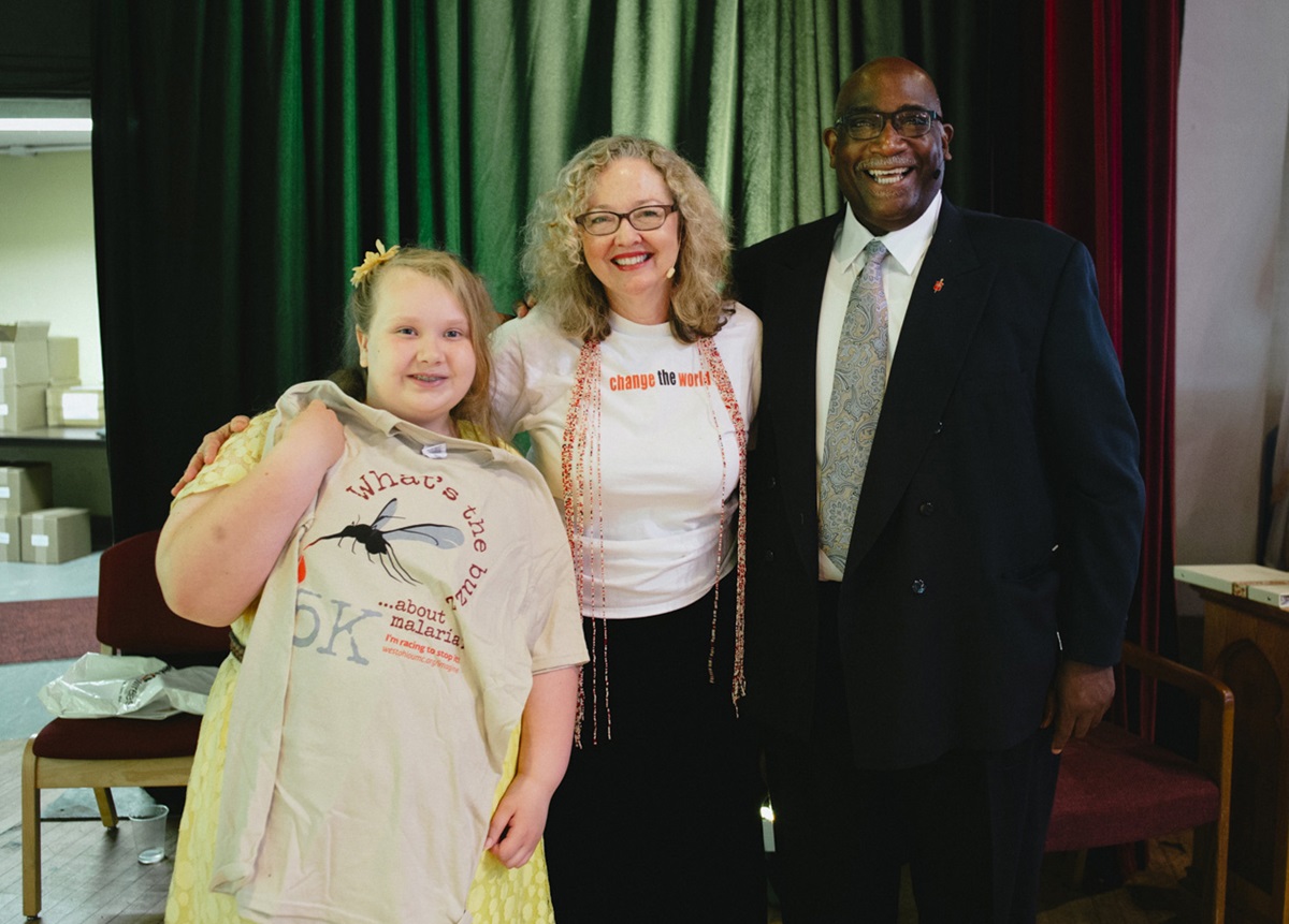 Gracie Douglas, a fourth-grader from Leipic United Methodist Church, raised $130 at school for Imagine No Malaria.  With her are Bishop Gregory V. Palmer and the Rev. Bobbi Kaye Jones, guest speaker from the Texas Annual Conference. Photo by Benjamin Derkin, West Ohio Conference.