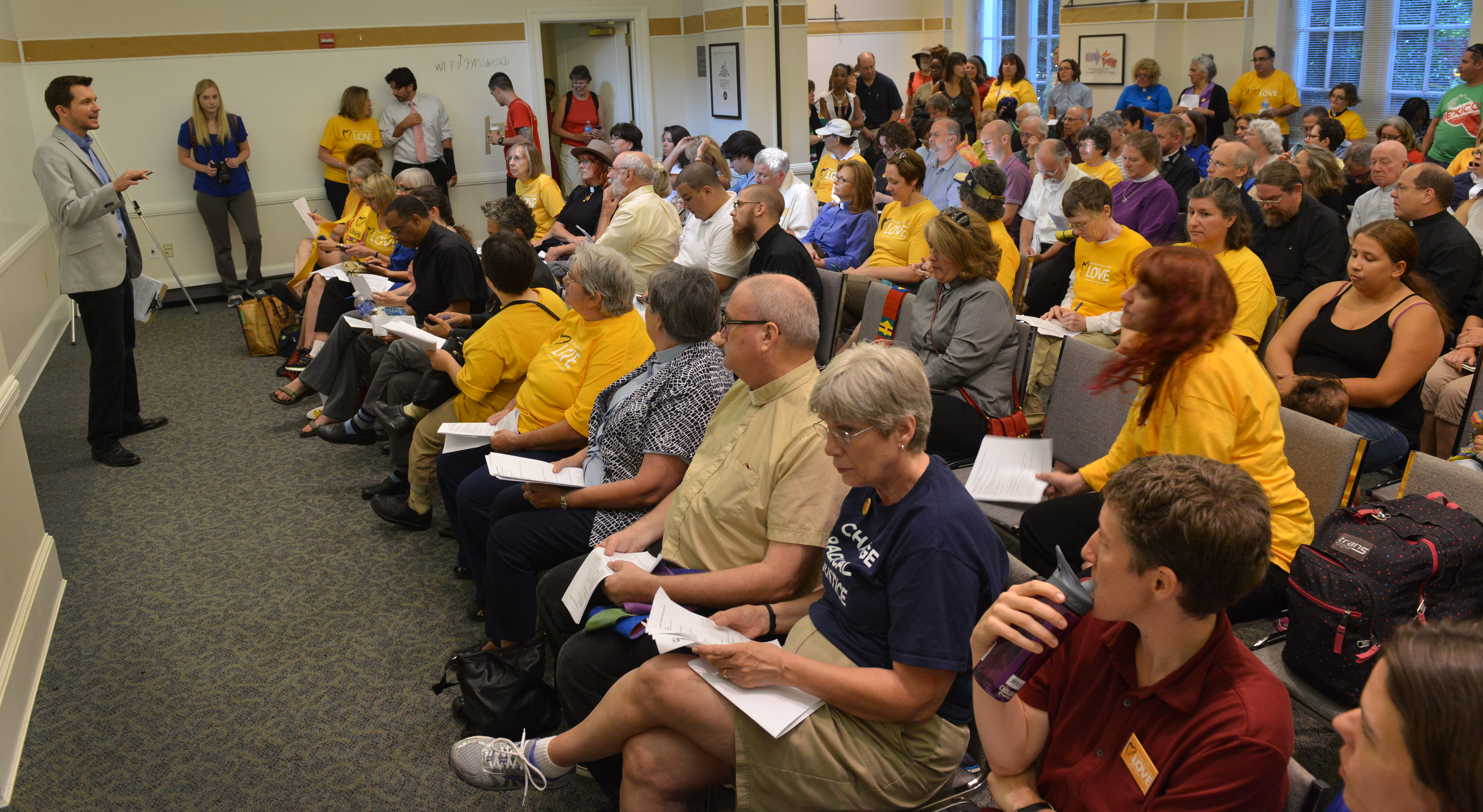 Members of The United Methodist Church along with other faith leaders and immigration activists start a "Day of Prophetic Action" on immigration policies with prayer at the United Methodist Building July 31. 