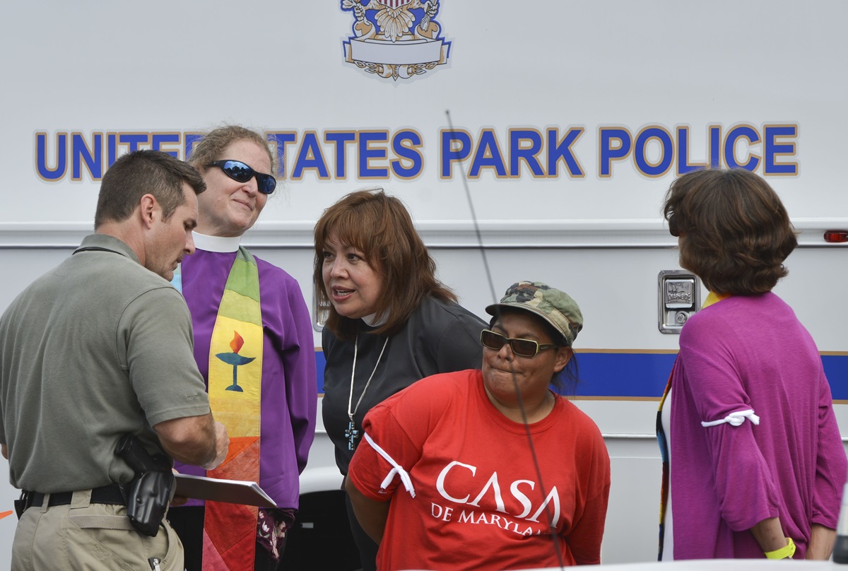 United Methodist Bishop Minerva Carcaño is arrested along with other faith leaders protesting the daily deportation of 1,100 people by the Obama Administration.