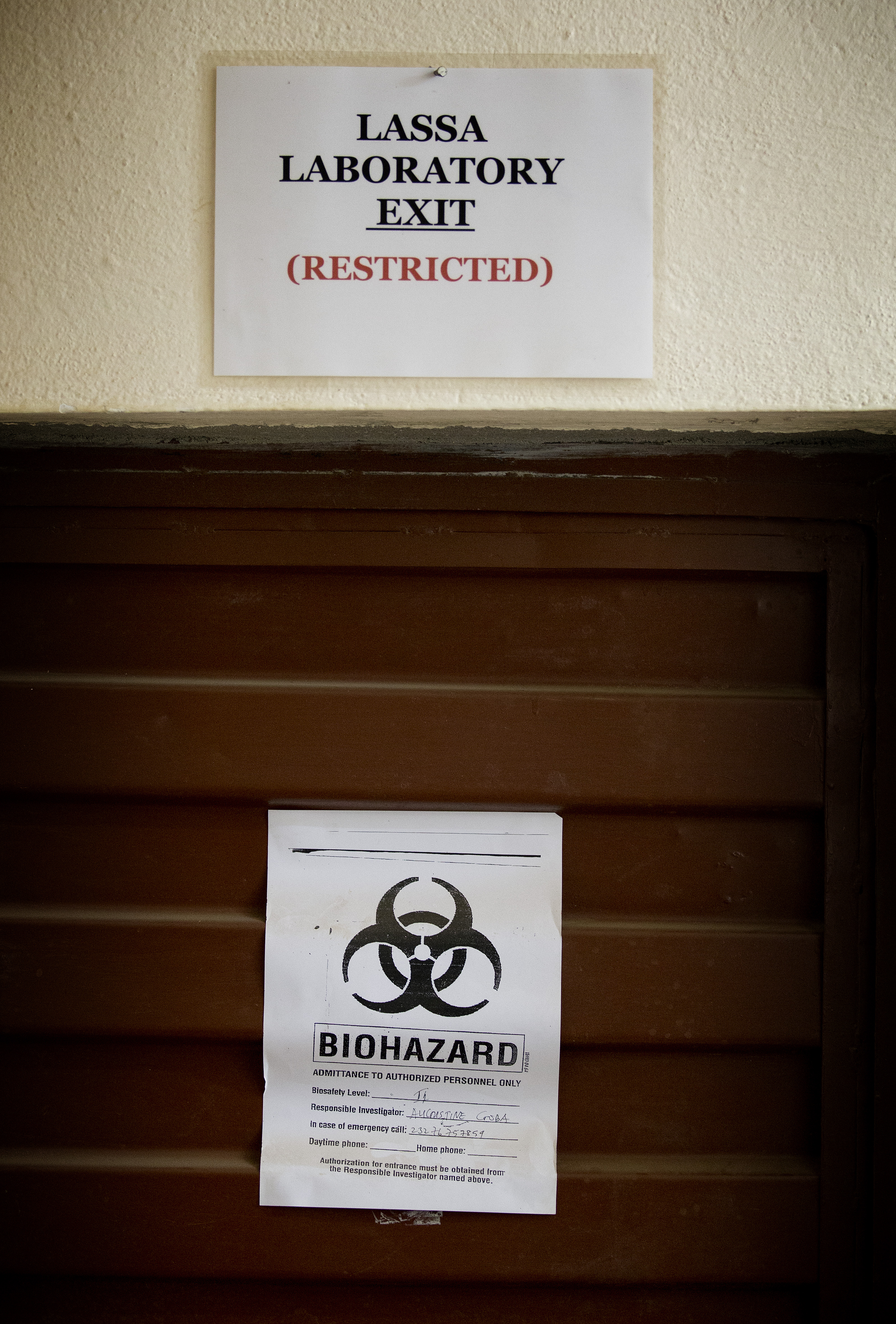 Signs warn of biological hazards in the Lassa fever laboratory at the government hospital in Kenema, Sierra Leone, where current efforts are centered on preventing the spread of the Ebola virus. 