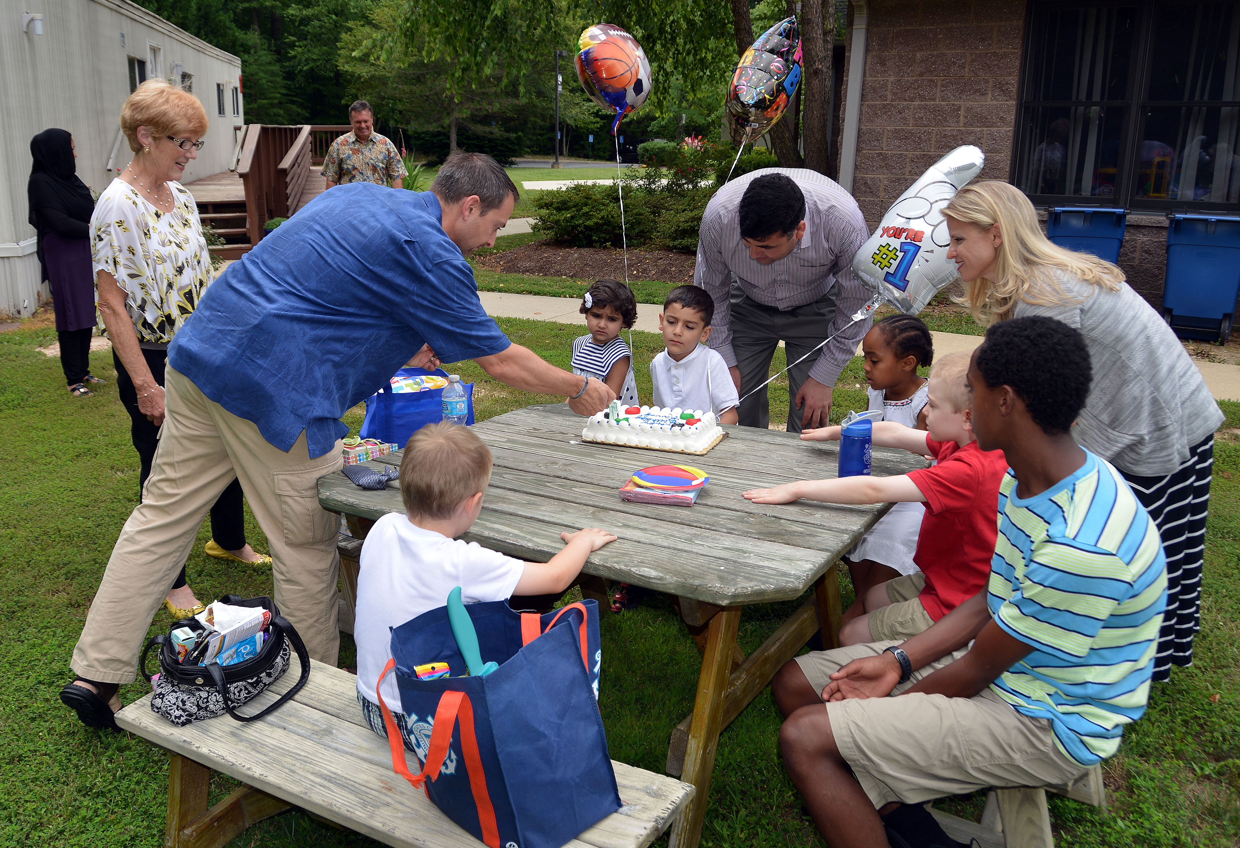 Friends from Christ Church, a United Methodist congregation in Fairfax Station, Va., help celebrate the sixth birthday of Rawof (center) whose father, Hameed, served as a translator for the U.S. military in his native Afghanistan. 
