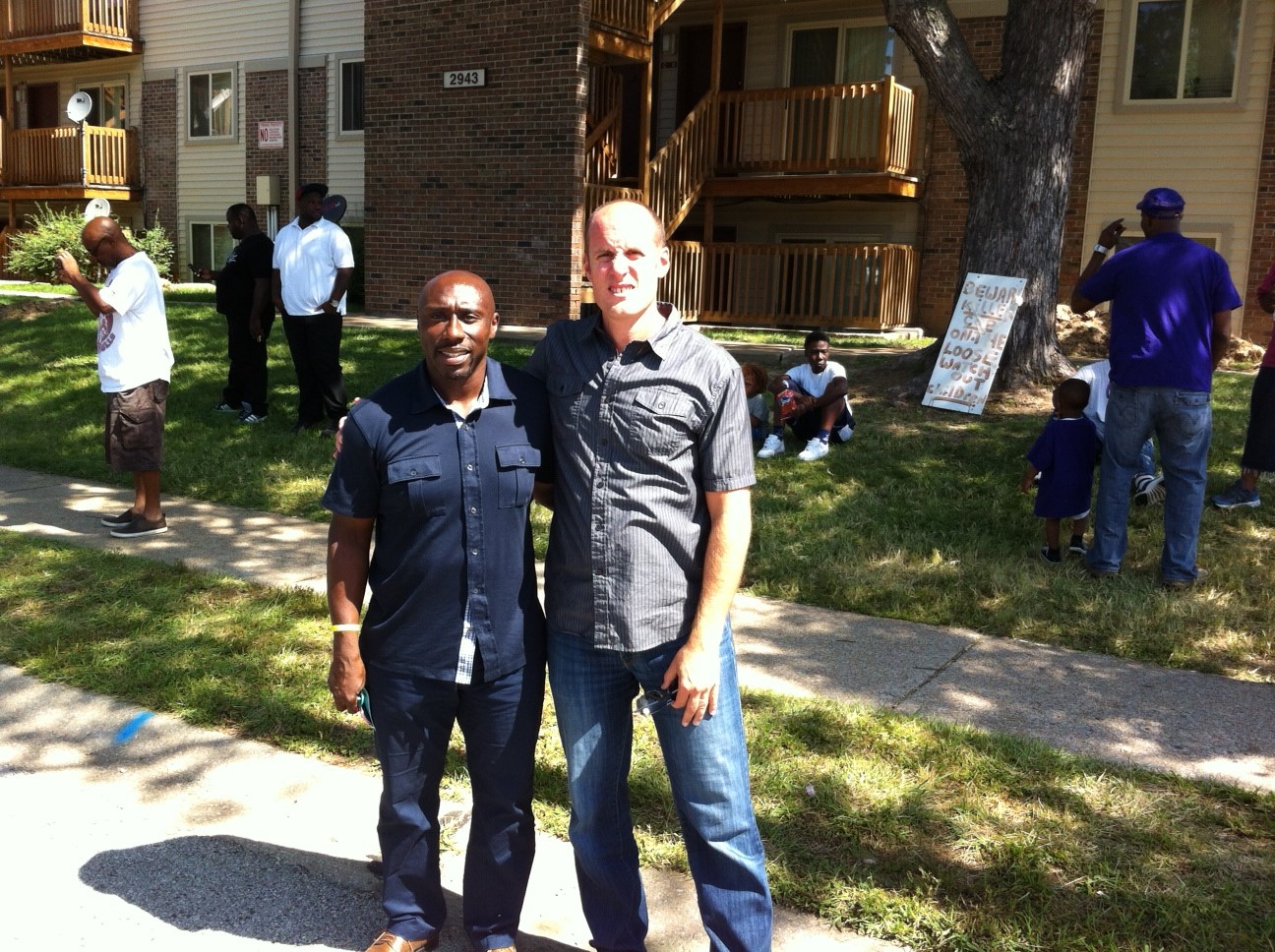The Rev. Willis Johnson (left), pastor of Wellspring United Methodist Church in Ferguson, Mo., and the Rev. Matt Miofsky of The Gathering,  in the St. Louis area, stand near the site where Michael Brown was killed  in August, 2014. Photo courtesy of the Rev. Matt Miofsky.
