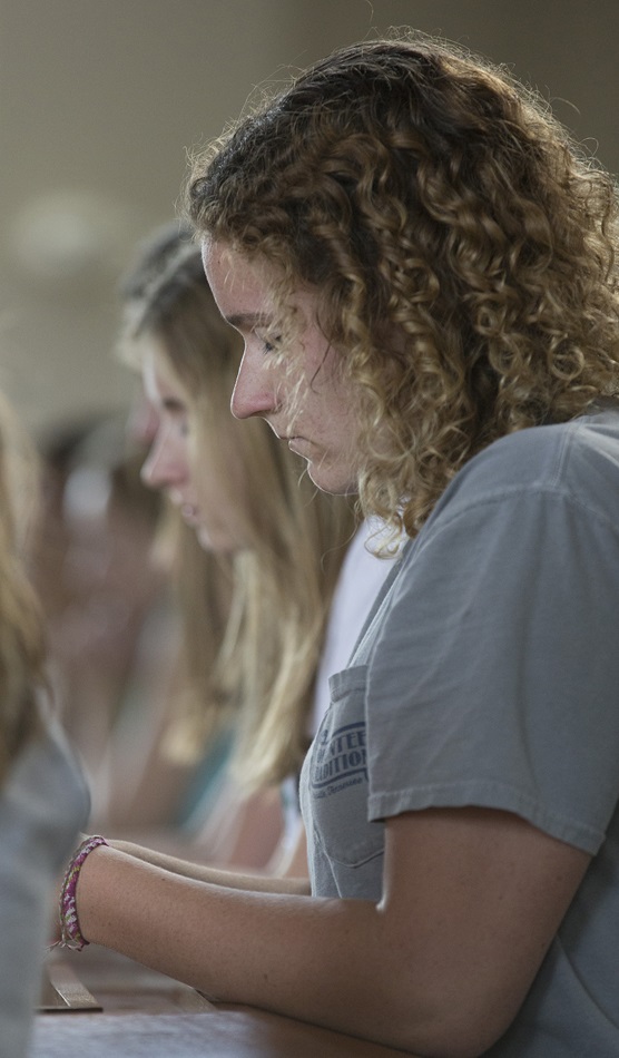 Angela Cross prays during a service at Christ United Methodist Church in Franklin, Tenn., to lift up those facing the Ebola crisis in West Africa. Cross was part of a youth mission team from the church to Sierra Leone in 2013 and has close friends there. 