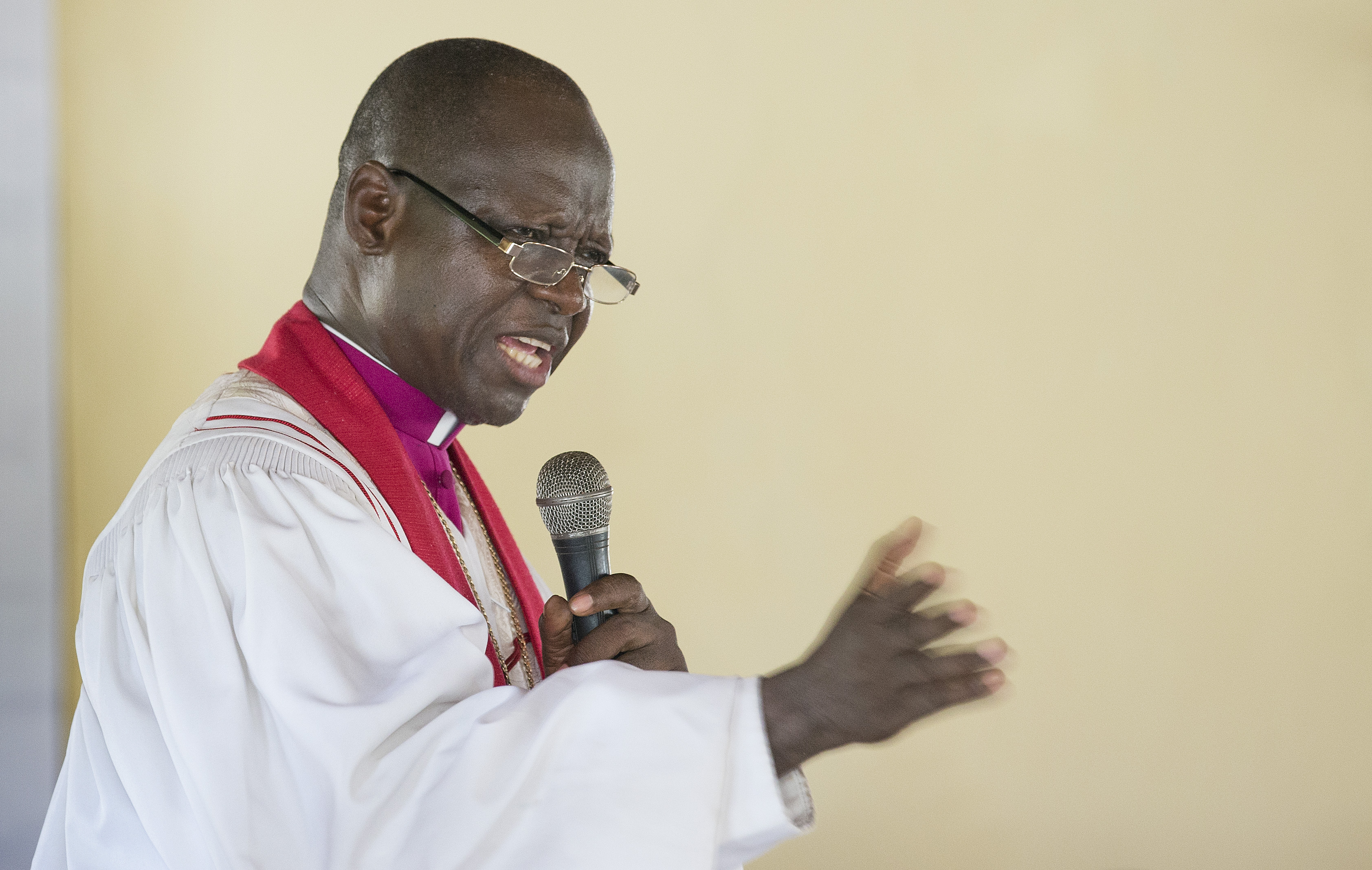 Bishop John K. Yambasu leads a service of dedication at Valunia United Methodist Church in Monghere, outside Bo, Sierra Leone. 