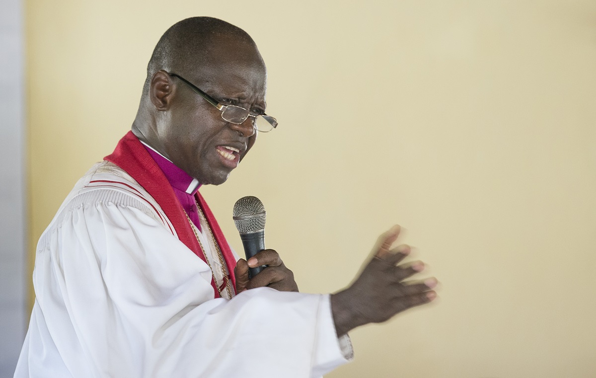 Bishop John K. Yambasu leads a service of dedication at Valunia United Methodist Church in Monghere, outside Bo, Sierra Leone. 
