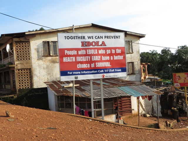 Ebola information billboards are displayed by government health partners. Photo by Phileas Jusu