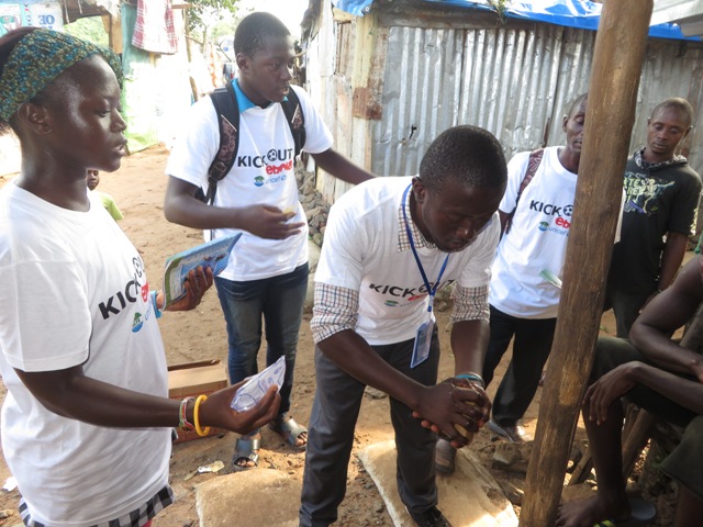 Volunteers demonstrate hand-washing at a slum near Juba in Freetown. Photo by Phileas Jusu