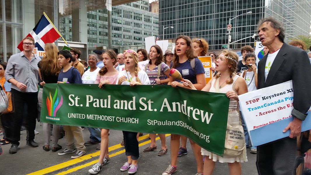 Members of the United Methodist Church of Saint Paul and Saint Andrew make their presence known as they walk in the People’s Climate March Sept. 21 in New York. Photo by James K. Karpen, UMNS