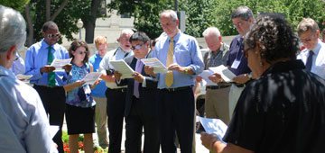 Participants gather in prayer support for a 
