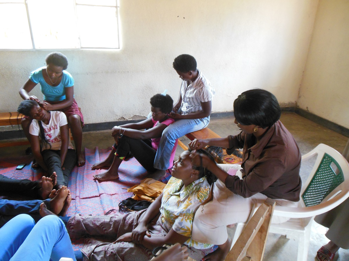 Women in Kigali, Rwanda, learn skills such as hairstyling as part of an economic empowerment project of Mbwirandumva, “Speak I’m Listening,” for impoverished women. Photo courtesy of Don Messer. 