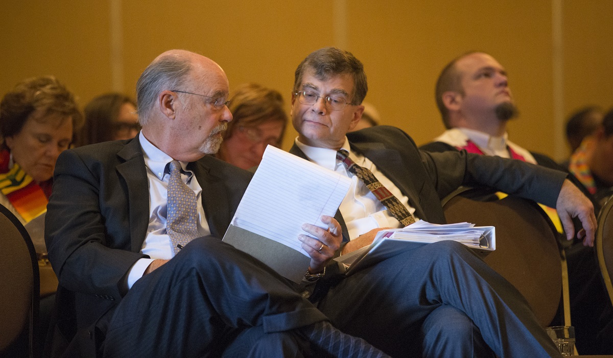 Robert Shoemaker (left) and the Rev. Christopher Fisher confer during an oral hearing before the United Methodist Judicial Council which will decide whether to uphold the reinstatement of the Rev. Frank Schaefer, who lost his credentials after being found guilty in a church trial last November of performing a same-sex wedding ceremony for his son. The hearing opened the council’s Oct. 22-25 fall meeting in Memphis, Tenn. 