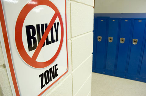 No bullying zone sign in school hallway. Photo by iStockphoto/Patrick Herrera.