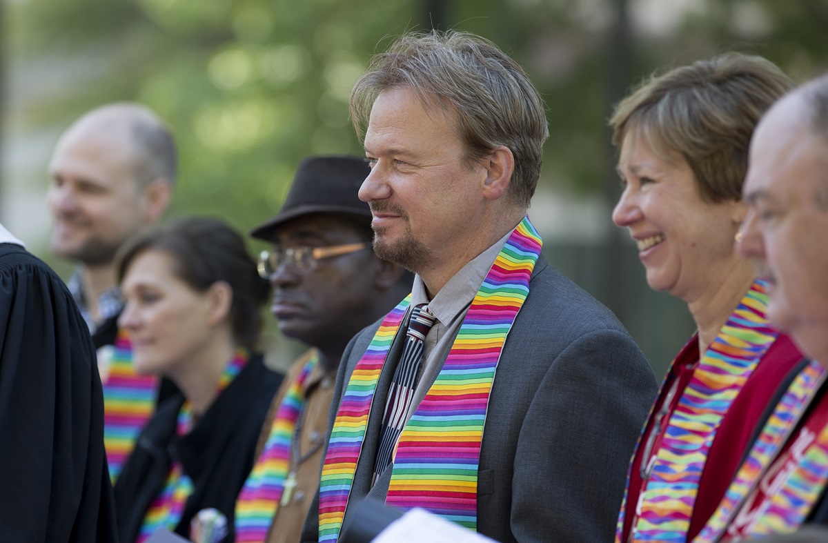 The Rev. Frank Schaefer (third from right) stands with family and supporters during a prayer service for unity at Court Square Park in Memphis, Tennessee, prior to the Oct. 22 oral hearing on his case by the United Methodist Judicial Council. Schaefer was found guilty in a November 2013 church trial of performing a same-sex wedding ceremony for his son but regained his clergy credentials upon appeal. Photo by Mike DuBose, UMNS.