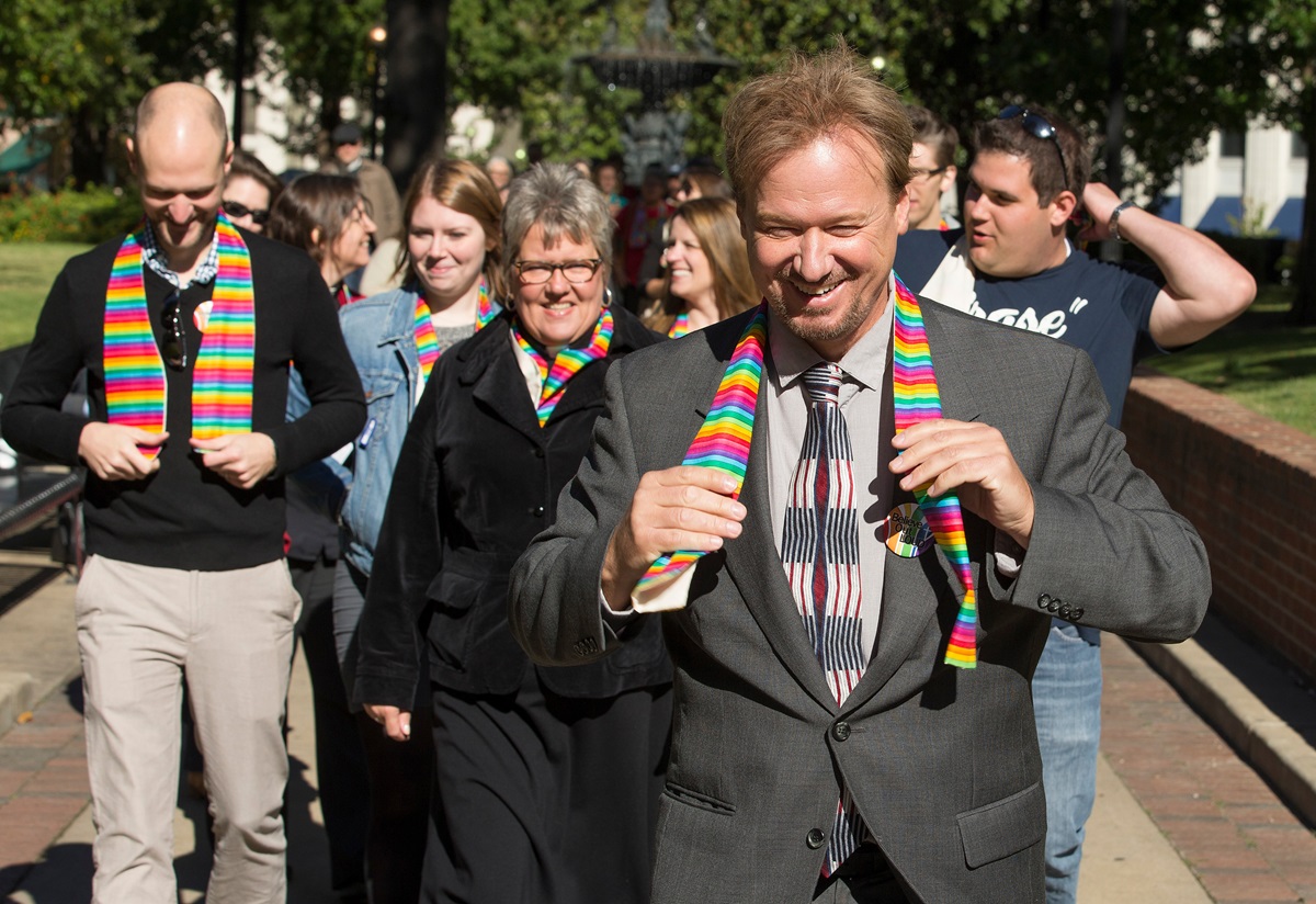 The Rev. Frank Schaefer (right) leads a procession of supporters from Court Square Park in Memphis, Tenn., on the way to his appearance before the United Methodist Judicial Council. 