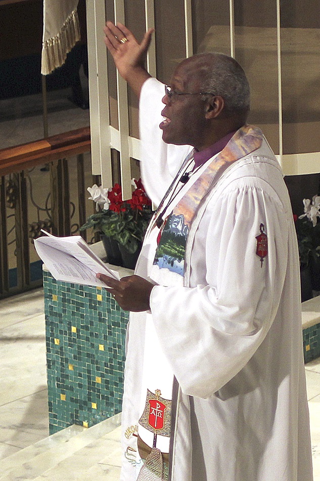 Bishop Warner Brown, president of the Council of Bishops, presides over Communion at St. Luke United Methodist Church in Oklahoma City. Photo by Holly McCray