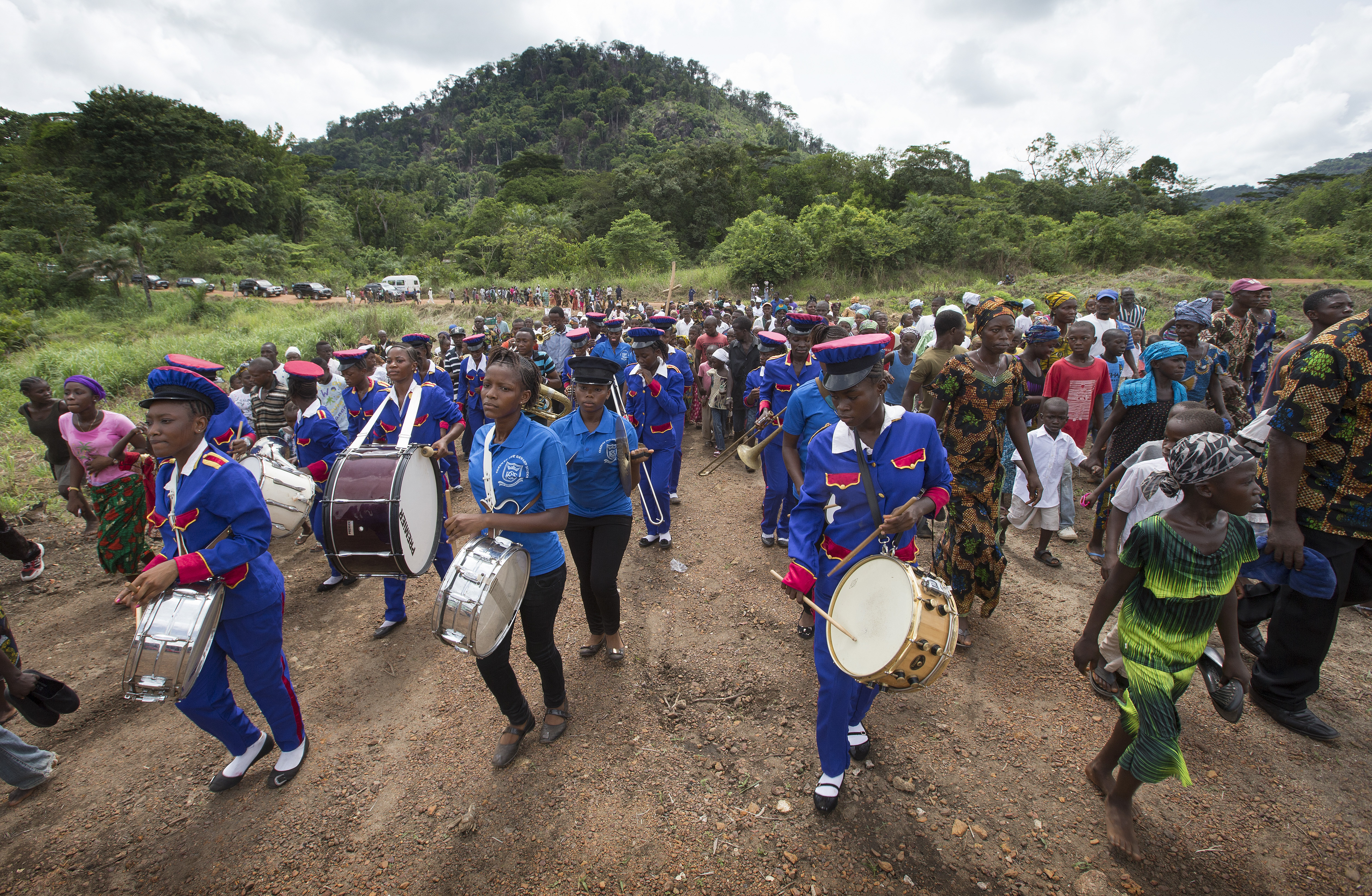 A marching band from Queen of the Rosary School in Bo, Sierra Leone, leads a parade in celebration of the dedication of Valunia United Methodist Church in Monghere, outside Bo. 