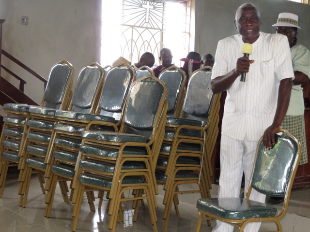 Men at the Charles Davis United Methodist Church purchased 40 new chairs to handle the increase in church attendance.  The church is located in in Western Freetown, Sierra Leone. 