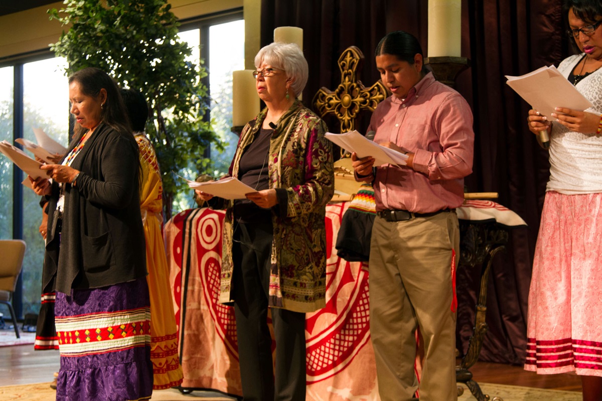 Tribal members from Oklahoma participate in readings (skits) that explain challenges facing indigenous peoples during the Act of Repentance service at the Council of Bishops meeting in Oklahoma City. Photo by Ginny Underwood, UMNS