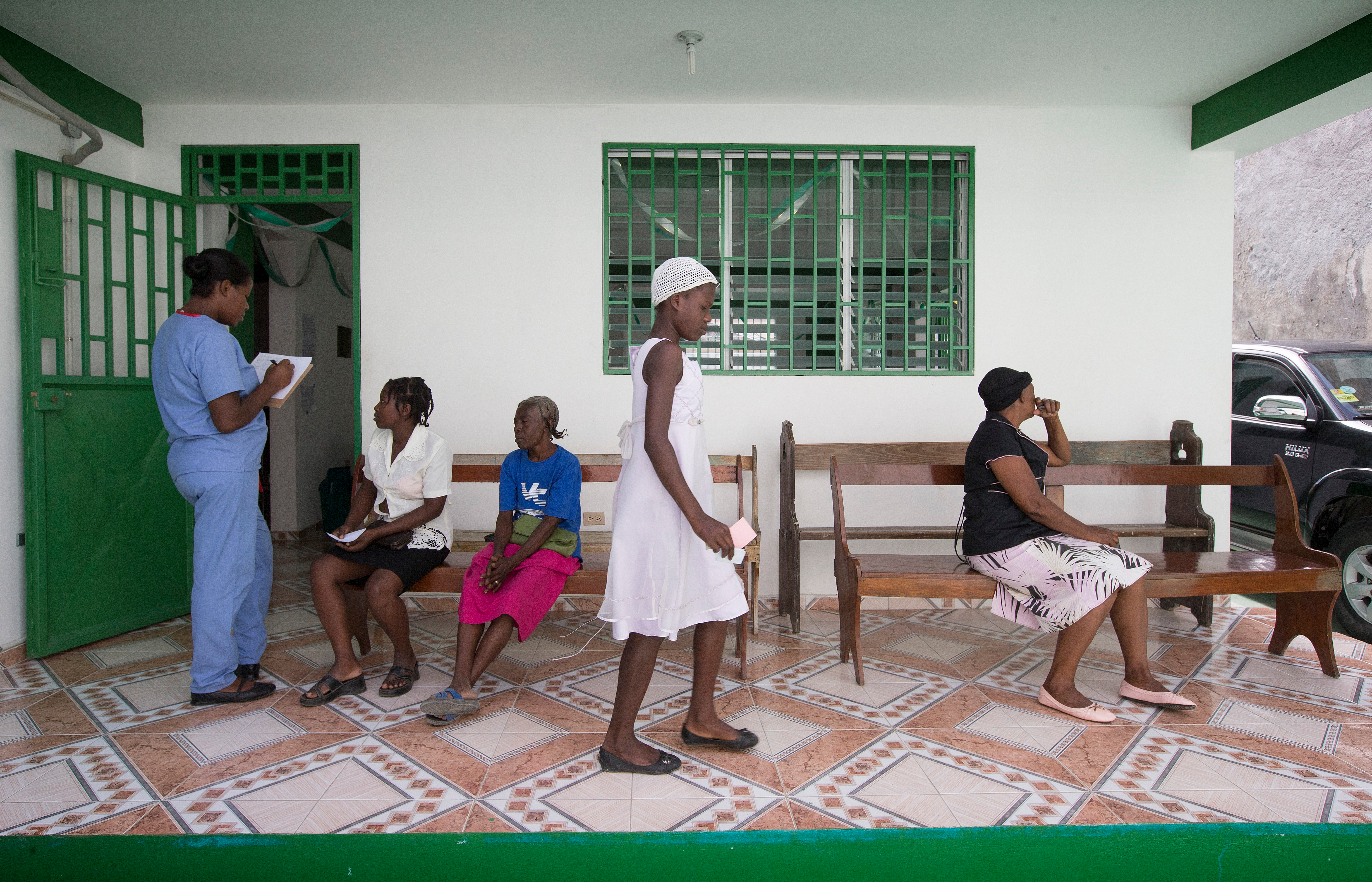 ​2014: Patients wait to be seen at the Haiti Eye Clinic in Petit-Goâve. The clinic is back in operation after being rededicated in January 2014. 
