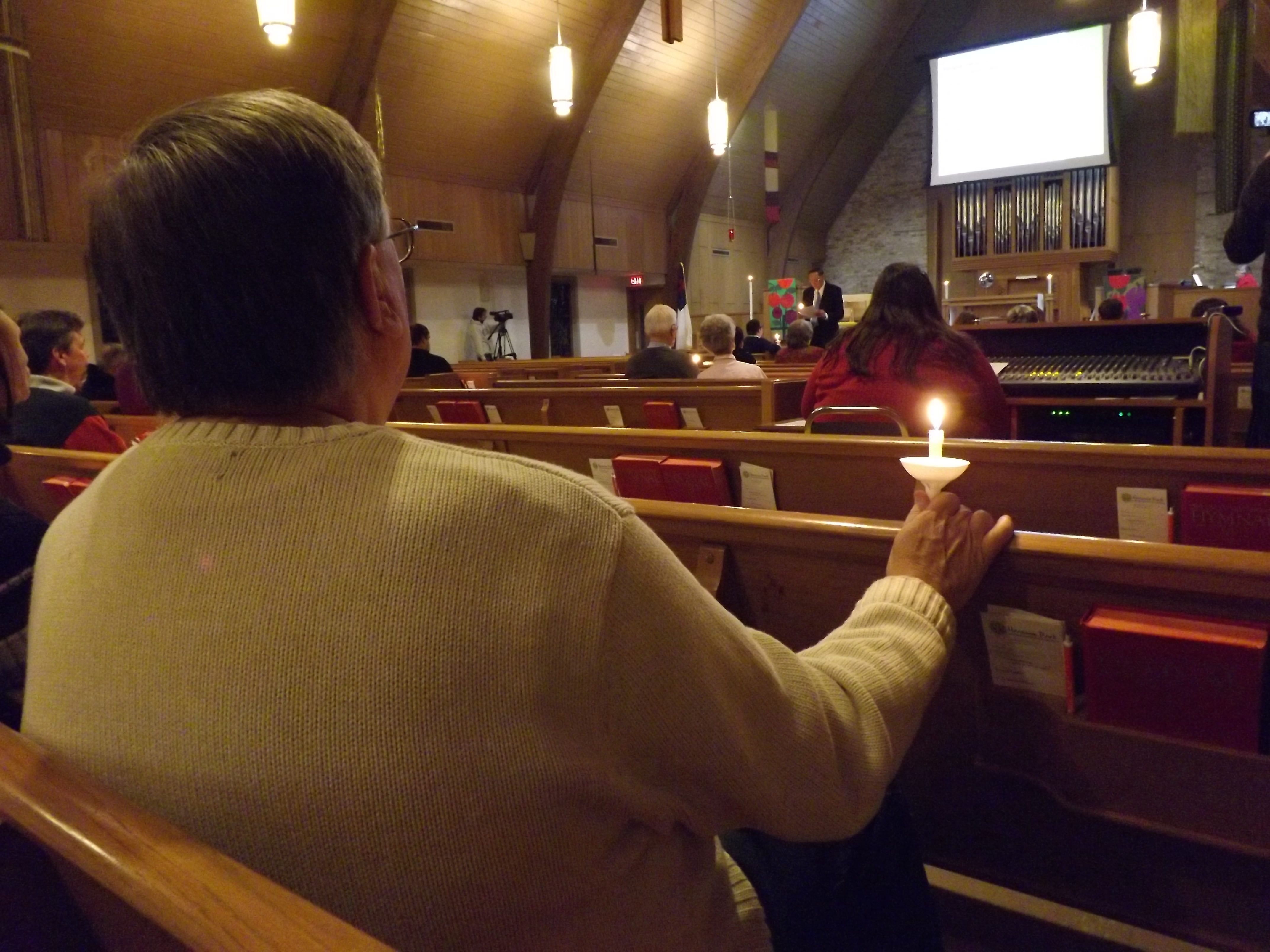 People gather to pray for Dr. Martin Salia at Hanscom Park United Methodist Church in Omaha, Neb., Nov. 16. 