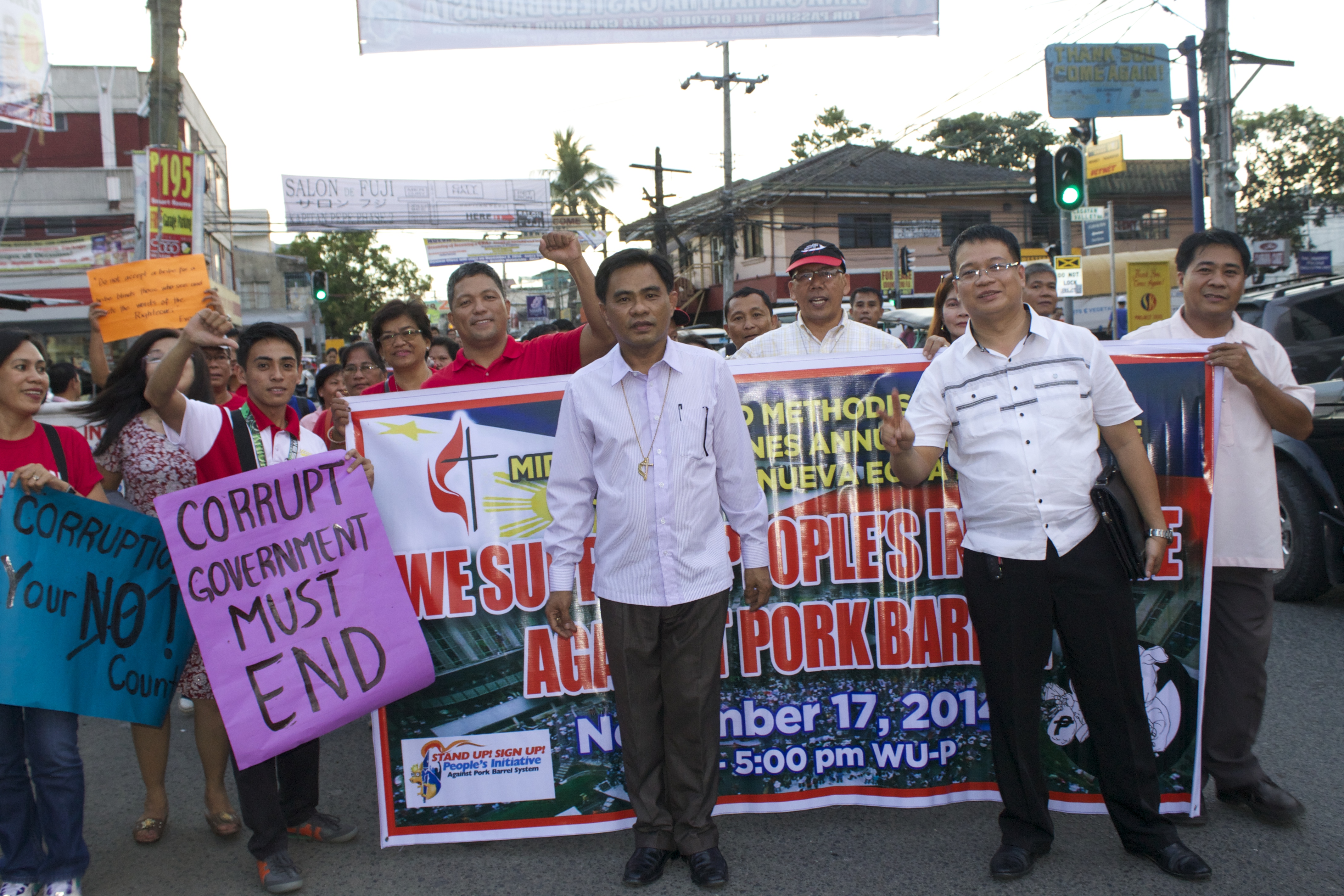 Bishop Rodolfo Alfonso Juan (center) of the Manila Area was instrumental in holding a liturgy, walk, and candlelight vigil against corruption in the government.  Photo courtesy of Gladys P. Mangiduyos