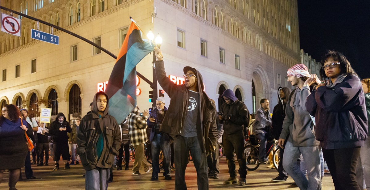 Peaceful protesters gather in Oakland, California following the no indictment decision for the killing of Michael Brown by police officer Darren Wilson in Ferguson, Missouri. Taken Nov. 24, 2014. Photo by Amir Aziz, courtesy of Flickr.