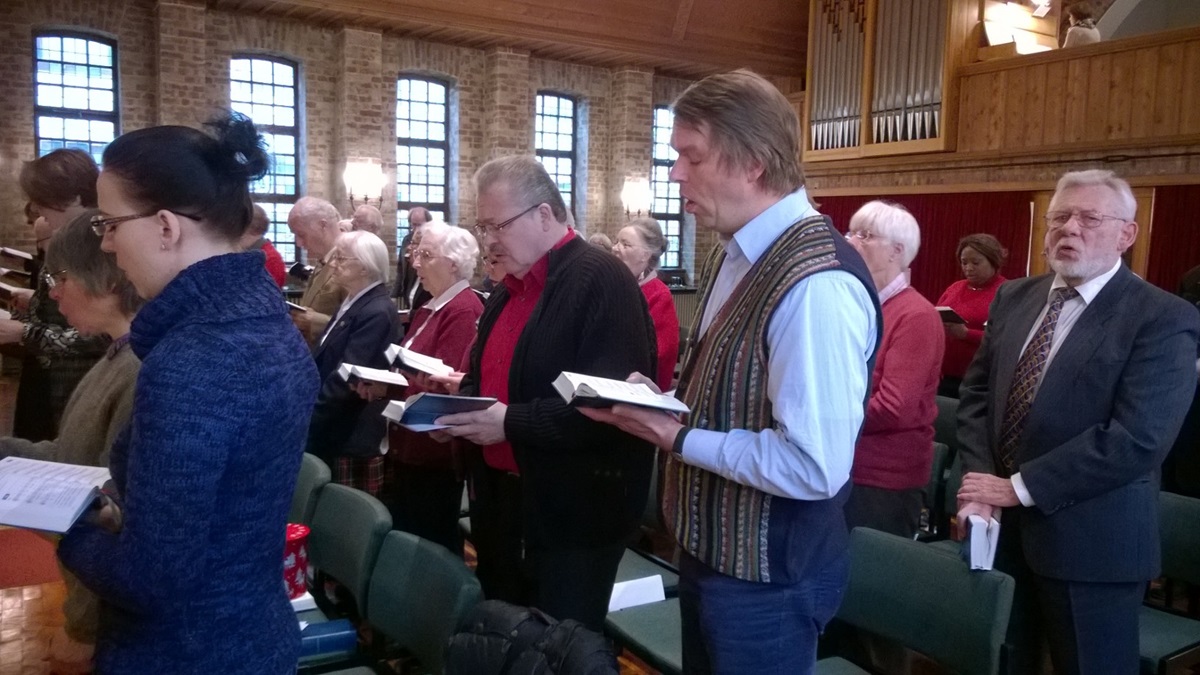 The congregation at the United Methodist Erlöserkirche (Church of the Redeemer) in Bremen, Germany, sings “Silent Night” in preparation for a Christmas Eve connection with Knutsford Methodist Church in Cheshire, England. Photo by Kathleen LaCamera/UMNS